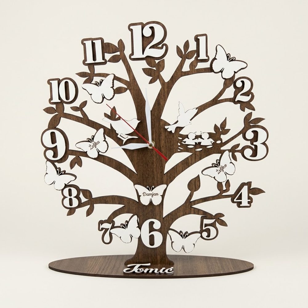 Wooden tree-shaped clock with butterflies, numbers and the family name on the base